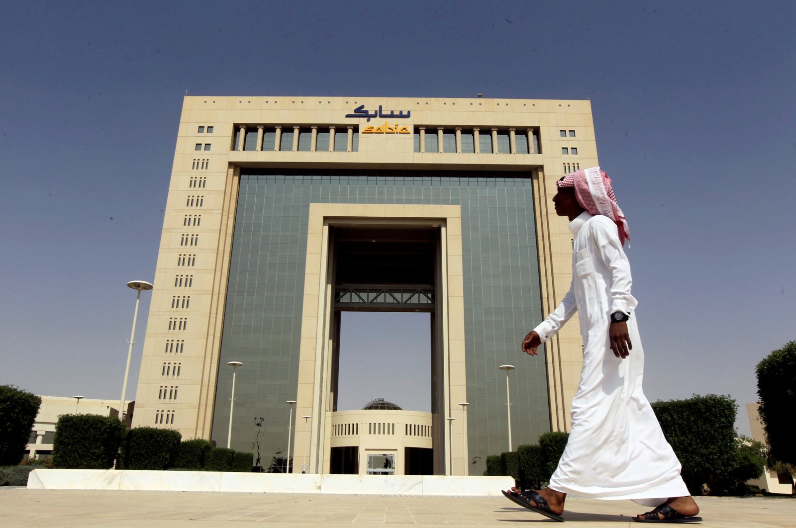 A man walks past the headquarters of Saudi Basic Industries Corp (SABIC) in Riyadh, Saudi Arabia, Oct. 27, 2013. (Reuters Photo)