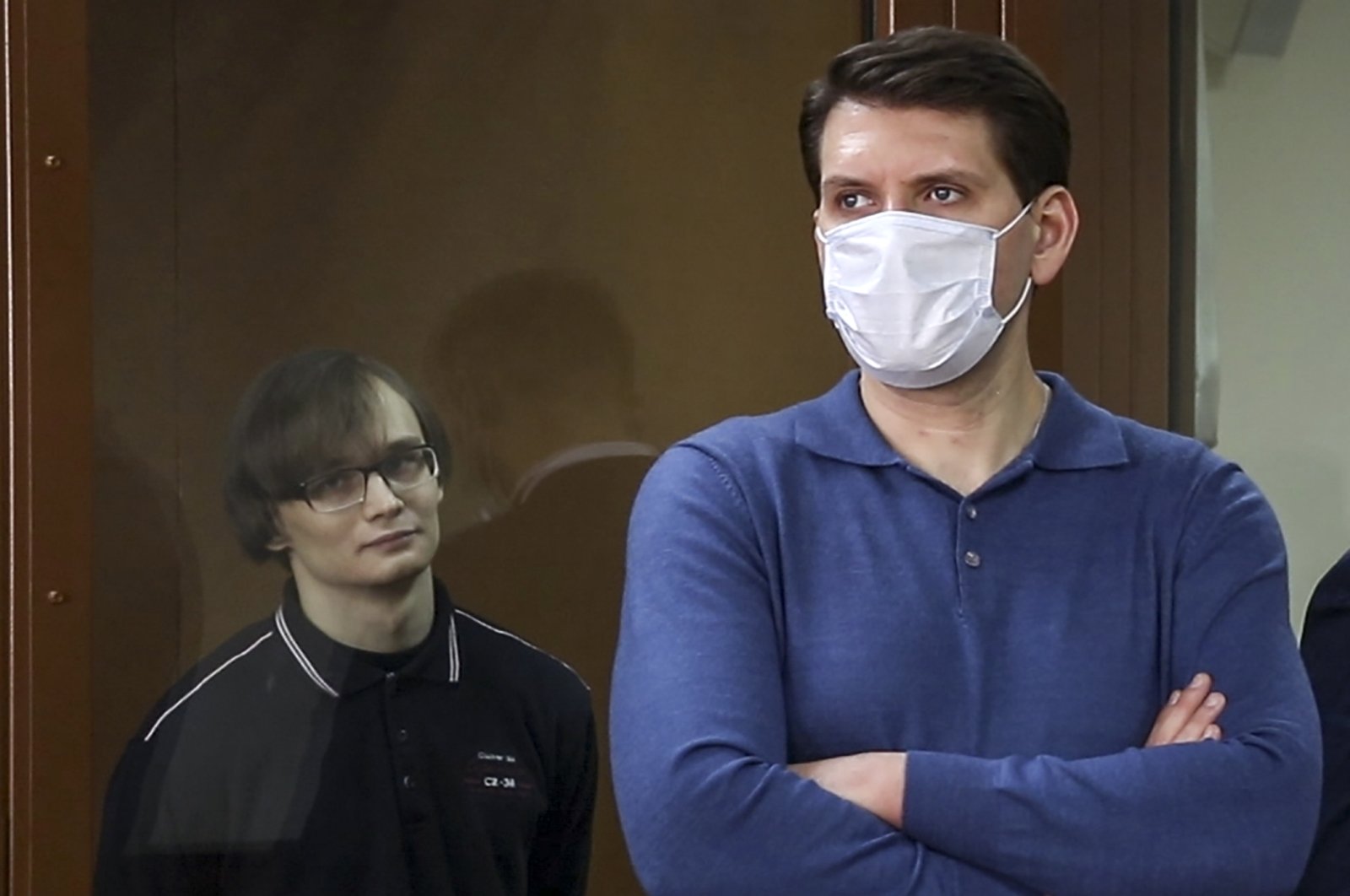 Defendant Azat Miftakhov (L), a postgraduate at Lomonosov Moscow State University, attends the announcement of the verdict in the case of the January 2018 attack on a local United Russia Party office at Moscow's Golovinsky District Court. Video screengrab. (Press Office of Moscow's Golovinsky District Court/TASS via Reuters)

A STILL IMAGE TAKEN FROM VIDEO PROVIDED BY A THIRD PARTY. EDITORIAL USE ONLY.No use Russia.
