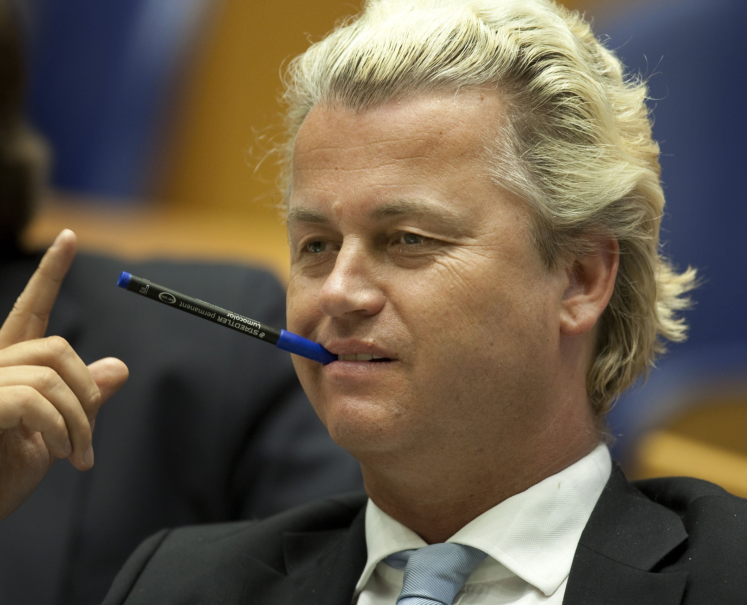 Geert Wilders, party leader of the Party for Freedom (PVV), chews a pen during weekly question time in the plenary room of the House of Representatives, The Hague, Netherlands, March 17, 2017. (EPA)