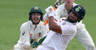 India's batsman Rishabh Pant plays a shot over the boundary line for six runs on day five of the fourth cricket Test match between Australia and India at the Gabba in Brisbane, Jan. 19, 2021.