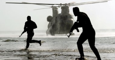 In this photo released by the Iranian Army, troops participate in a military drill, Gulf of Oman on Jan. 19, 2021. (Iranian Army via AP)