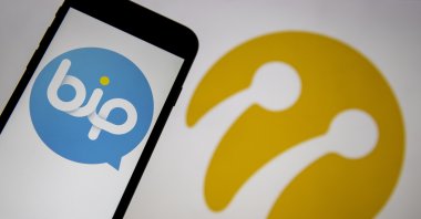 The logo of the Turkish messaging app BiP on a phone screen in front of the Turkcell logo in this illustration photo, Jan. 16, 2021. (AA Photo)