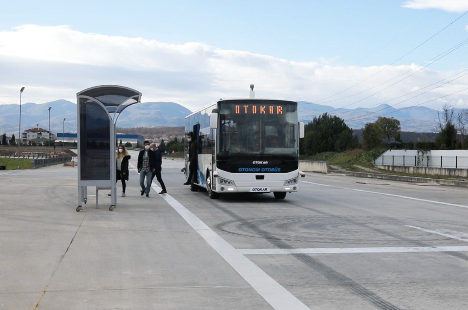 Passengers get off Turkey's first autonomous bus, manufactured by Otokar, Jan. 15, 2021. (Courtesy of Otokar)