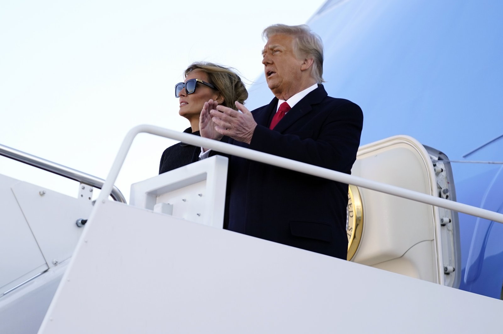 President Donald Trump and first lady Melania Trump board Air Force One at Andrews Air Force Base, Md., Jan. 20, 2021.(AP Photo)