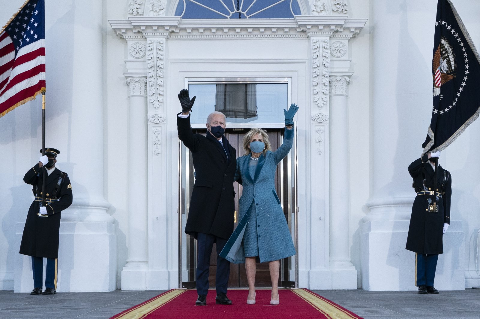 U.S. President Joe Biden and first lady Jill Biden wave as they arrive at the North Portico of the White House, Wednesday, Jan. 20, 2021, in Washington. (AP Photo)