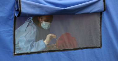 A traveler is tested for the coronavirus disease amid a nationwide COVID-19 lockdown, at the Grasmere Toll Plaza, in Lenasia, South Africa, Jan. 14, 2021. (Reuters Photo)