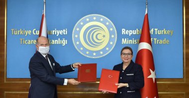 U.K. Ambassador to Ankara Dominick Chilcott (L) and Turkey's Trade Minister Ruhsar Pekcan at the signing ceremony of the Turkey-U.K. free trade agreement in the capital Ankara, Turkey, Dec. 29, 2020. (AA Photo)