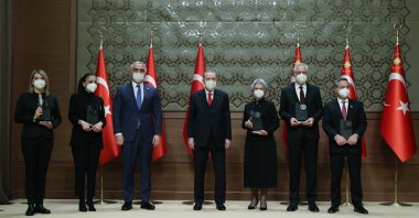 President Recep Tayyip Erdoğan and Culture and Tourism Minister Mehmet Nuri Ersoy pose with the prize winners at the Presidential Conference Hall, Ankara, Turkey, Jan. 20, 2021. (DHA PHOTO)