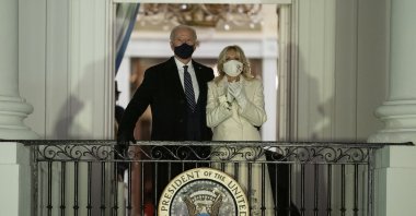 U.S. President Joe Biden and first lady Jill Biden watch fireworks from the White House, Washington, D.C., U.S., Jan. 20, 2021. (AP Photo)
