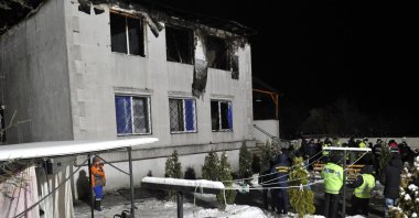 Police experts and members of emergency services work on the the site of a fire that broke out in a nursing home, in Kharkiv, Ukraine, Jan. 21, 2021. (AFP Photo)