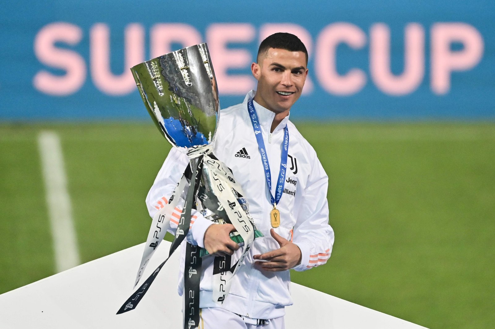 Juventus' Cristiano Ronaldo poses with the Italian Super Cup trophy at the Mapei Stadium - Citta del Tricolore, Reggio Emilia, Jan. 20, 2021. (AFP Photo)