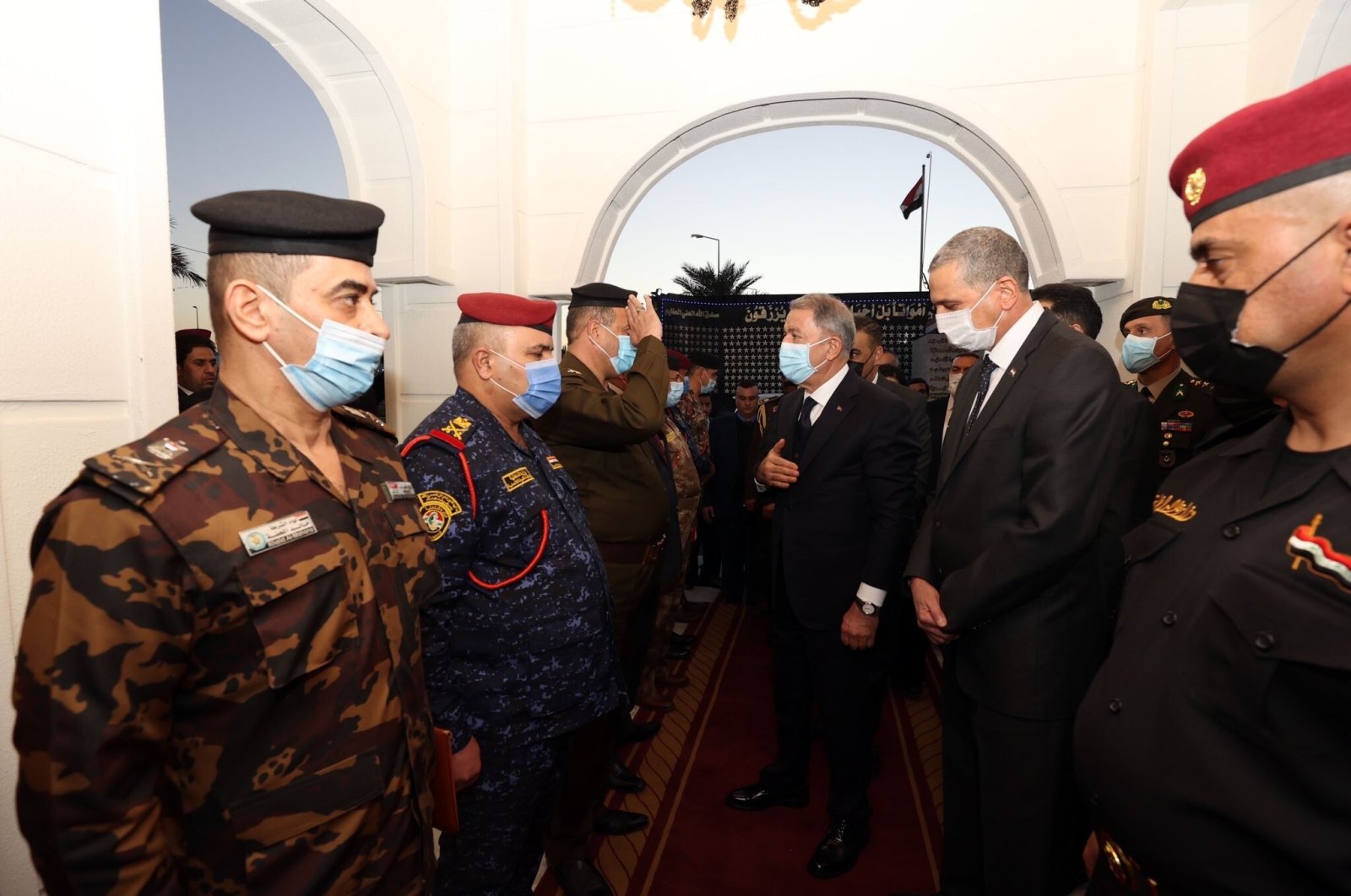 Defense Minister Hulusi Akar, alongside a Turkish delegation, meets with Iraqi Interior Minister Othman al-Ghanmi and Iraqi soldiers during a visit to Baghdad, Iraq, Jan. 18, 2021. (IHA Photo)