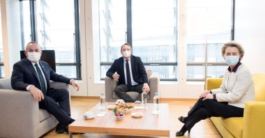 Foreign Minister Mevlüt Çavuşoğlu (L) speaks with Commissioner for Neighbourhood and Enlargement Oliver Varhelyi (C) and European Commission President Ursula von der Leyen (R) in Brussels, Belgium, Jan. 21, 2020. (AA Photo)
