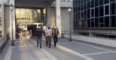 Police escort suspected Daesh terrorist C.A. out of the court in Osmaniye province, Turkey, Jan. 22, 2020. (IHA Photo)