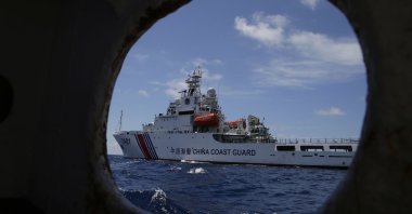 A Chinese Coast Guard ship attempts to block a Philippine government vessel as the latter tries to enter Second Thomas Shoal to relieve Philippine troops and resupply provisions, March 29, 2014. (AP Photo)