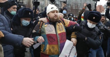 Police detain a man during a protest against the jailing of opposition leader Alexei Navalny in Moscow, Russia, Jan. 23, 2021. (AP Photo)