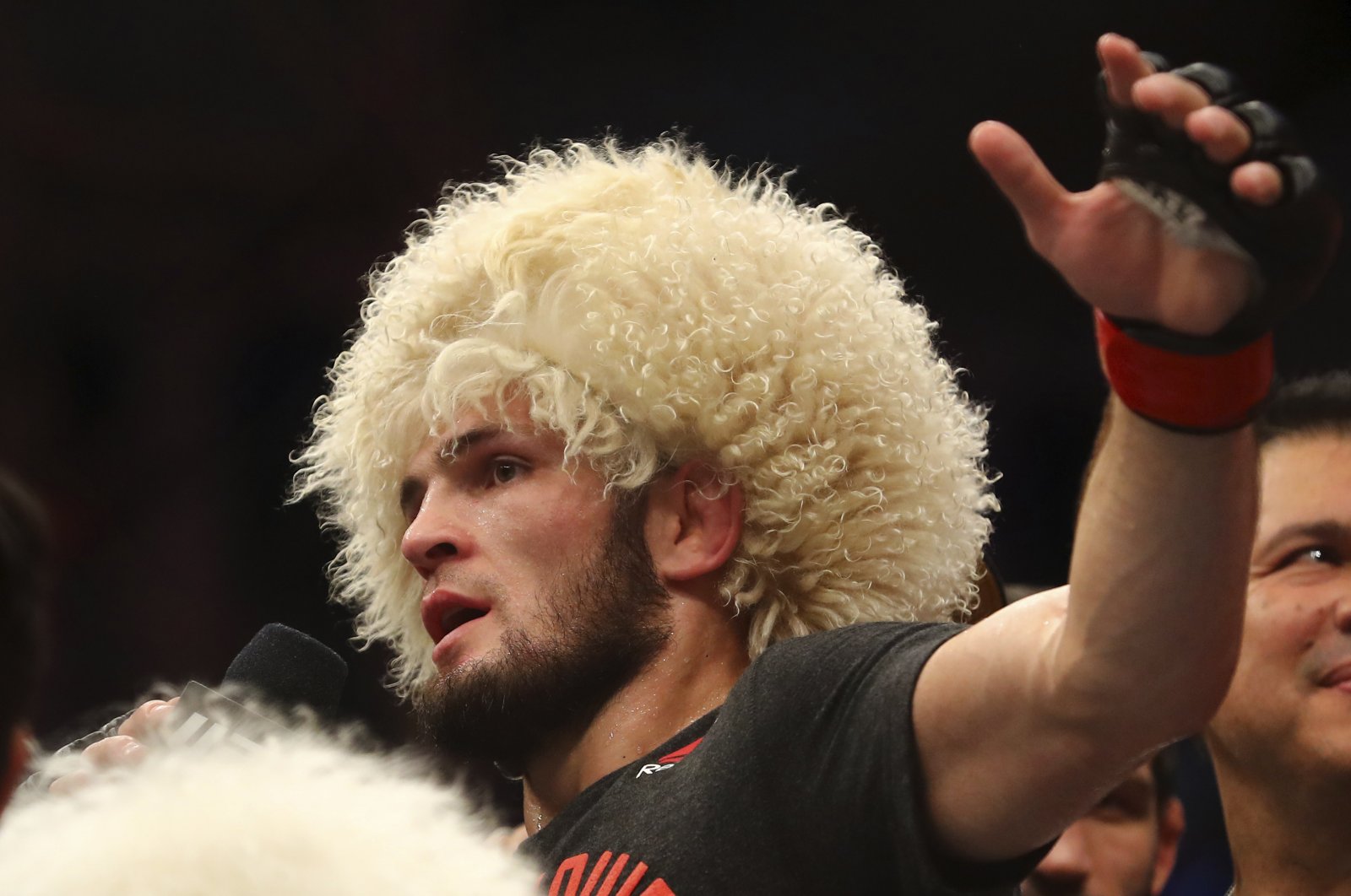 Russian UFC fighter Khabib Nurmagomedov, speaks after wining against UFC fighter Dustin Poirier during Lightweight title mixed martial arts bout at UFC 242, in Yas Mall in Abu Dhabi, United Arab Emirates, Sept. 7, 2019. (AP Photo)