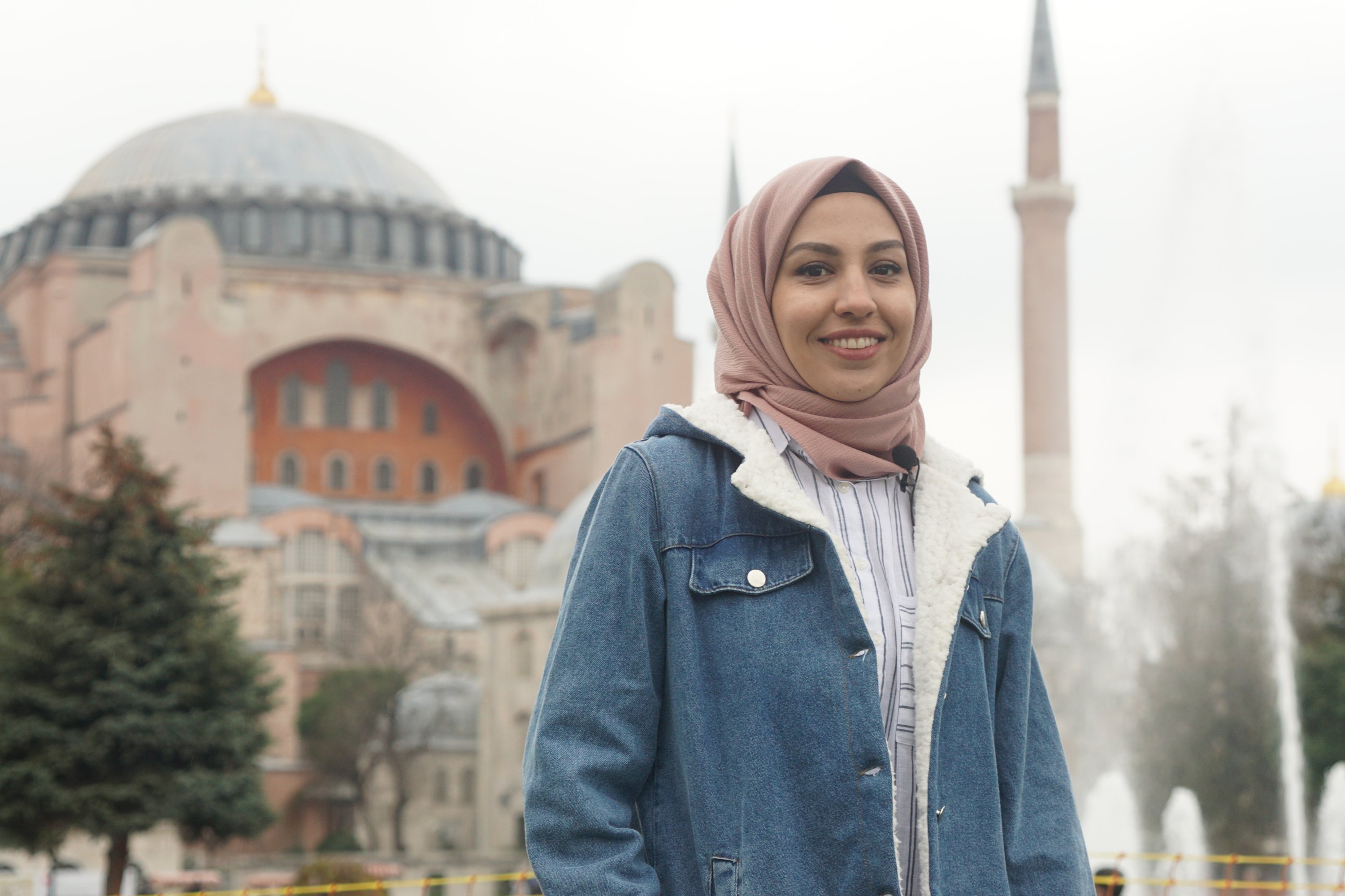 Afghan animation artist Sara Barackzay poses in front of the Hagia Sophia Grand Mosque in Istanbul, Jan. 22, 2021. (AA PHOTO)