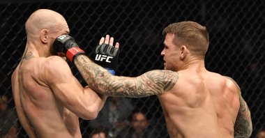  Dustin Poirier punches Conor McGregor in a lightweight fight during the UFC 257 event inside Etihad Arena on UFC Fight Island, Abu Dhabi, UAE, Jan. 23, 2021. (Reuters Photo)
