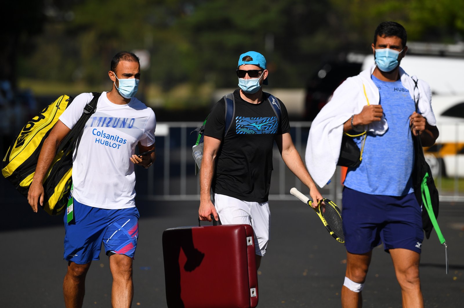 Columbian tennis player Juan Sebastian Cabal (L) exits the Park View Hotel to attend a training session in Melbourne, Australia, Jan. 21, 2021. (EPA Photo)