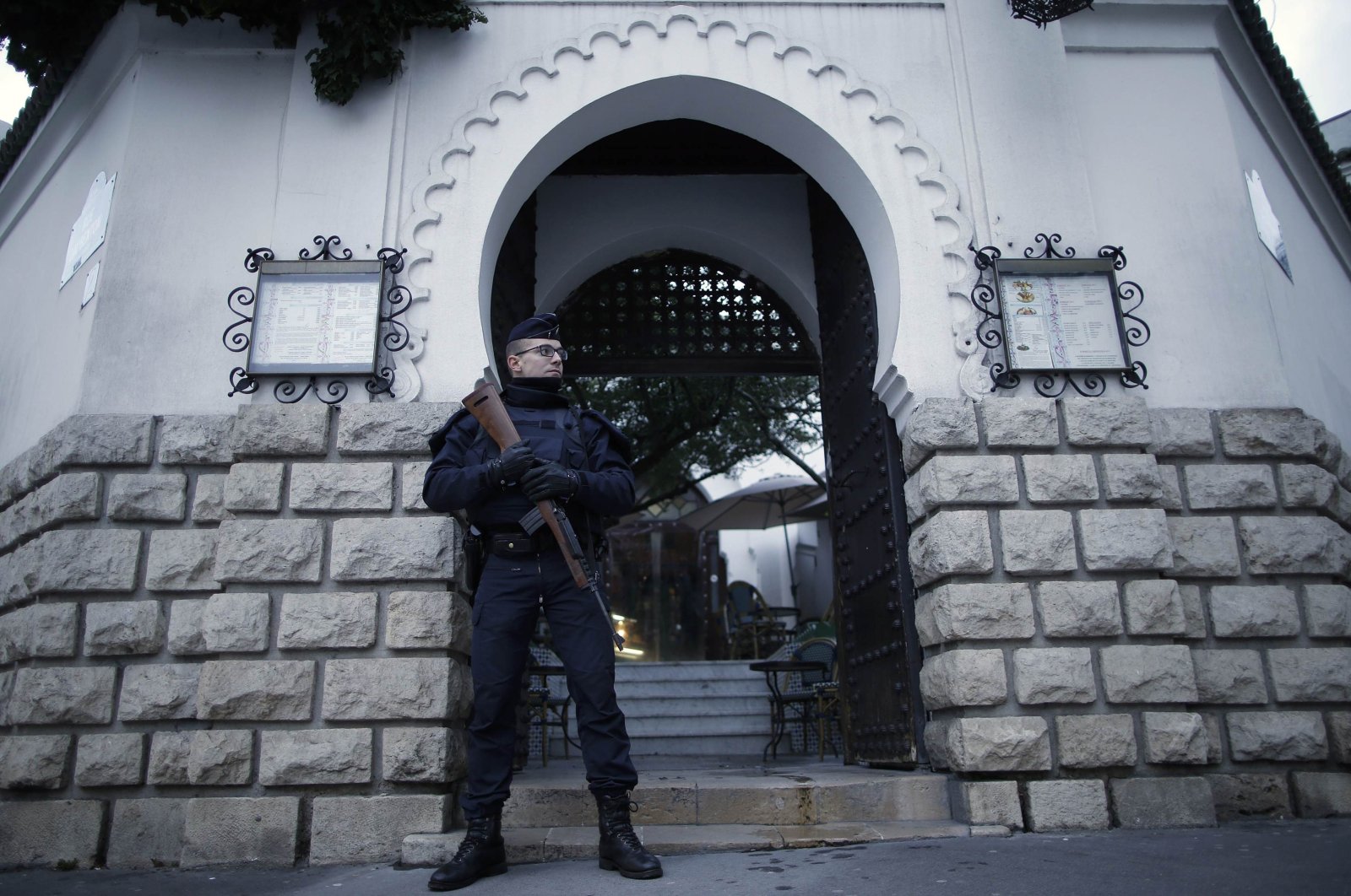 A French police officer stands guard in front of the entrance of the Paris Grand Mosque, Paris, France, Jan. 14, 2015. (Reuters Photo)