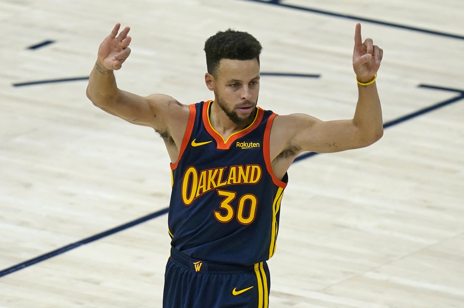Golden State Warriors guard Stephen Curry celebrates scoring a 3-pointer against the Utah Jazz in an NBA game, Salt Lake City, Jan. 23, 2021. (AP Photo)