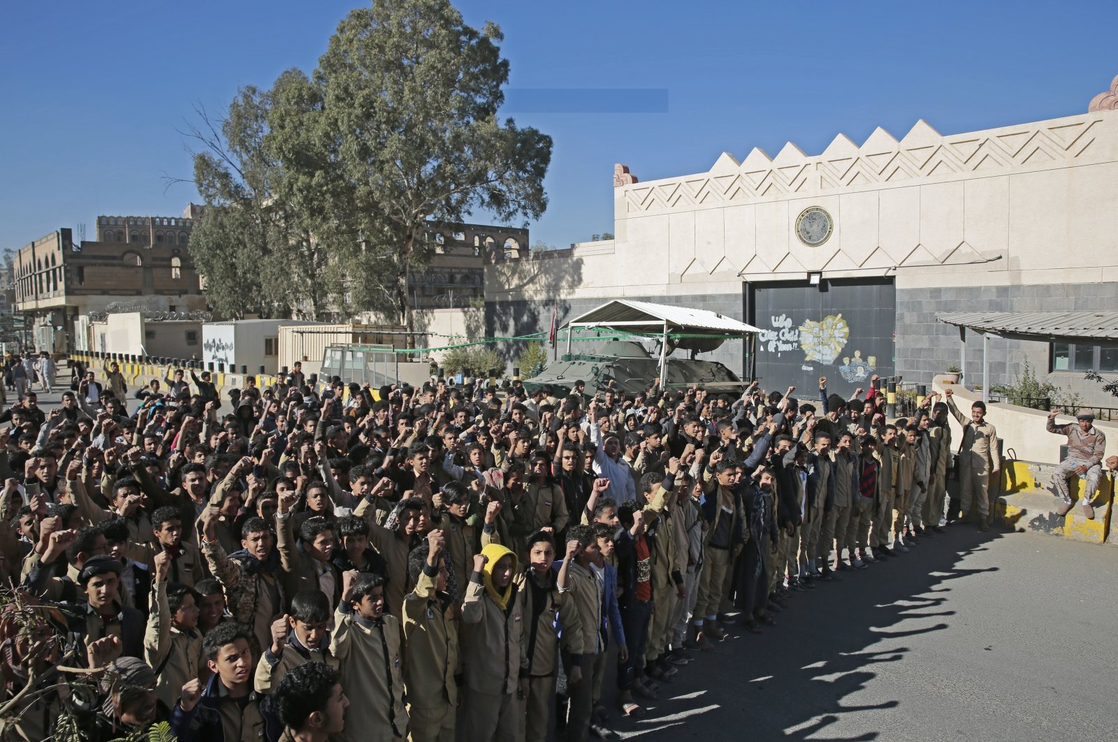 Houthi supporters chant slogans during a demonstration outside the closed U.S. Embassy over its decision to designate the Houthis a foreign terrorist organization, in Sanaa, Yemen, Jan. 18, 2021. (AP Photo)
