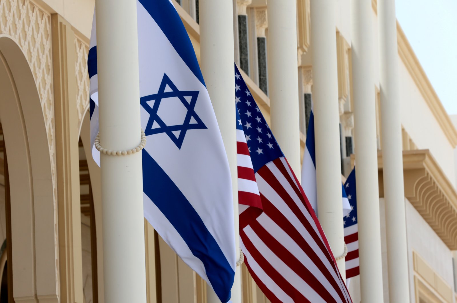 An Israeli flag and an American flag fly at Abu Dhabi International Airport before the arrival of Israeli and U.S. officials, in Abu Dhabi, United Arab Emirates (UAE), Aug. 31, 2020. (Reuters Photo)