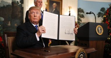 Then-U.S. President Donald Trump holds up a proclamation that recognizes Jerusalem as the capital of Israel, at the White House, Washington, D.C., Dec. 6, 2017. (Photo by Getty Images)