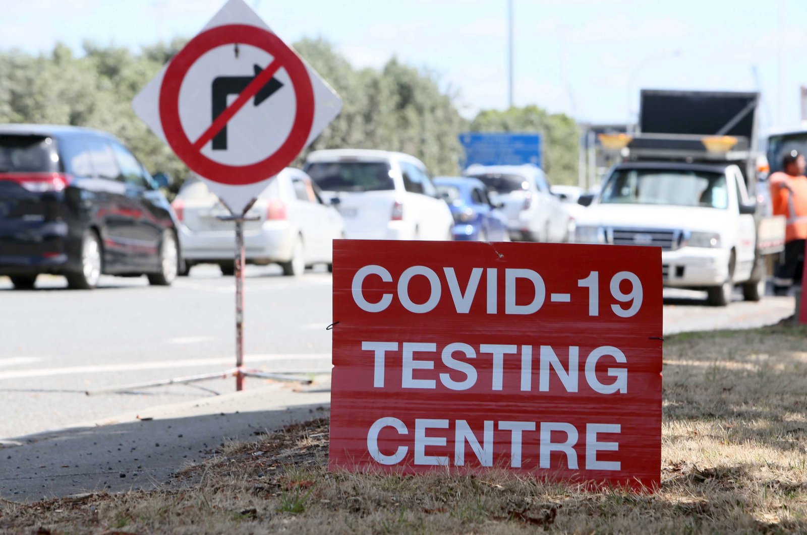 Signs direct drivers waiting for COVID-19 testing at a pop-up testing centre at Marsden Point, New Zealand, Jan. 25, 2021. (AP)