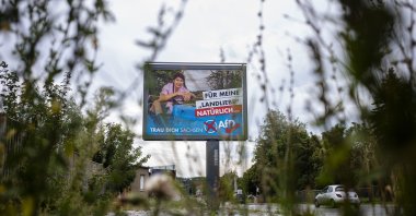 An election campaign poster of the German Alternative for Germany (AfD) party for the Saxony state elections reading, "For my country love, of course, AfD – dare you Saxony,"  is displayed on the road in Bautzen, Germany, Aug. 15, 2019. (AP Photo)
