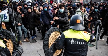 The police remove protesters from the 18 Septemberplein in Eindhoven, the Netherlands, Jan. 24, 2021. (EPA-EFE Photo)