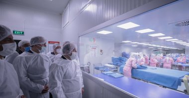 Industry and Technology Minister Mustafa Varank visits Bayteks, a firm that produces medical fabric in the Organized Industrial Zone in Kilis, southeastern Turkey, Jan. 22, 2021. (AA Photo)