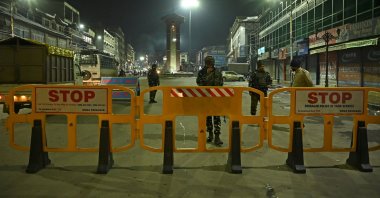 Paramilitary troopers stand guard along a street on the eve of India's Republic Day celebrations in Srinagar, India-occupied Jammu and Kashmir, Jan. 25, 2021. (AFP Photo)