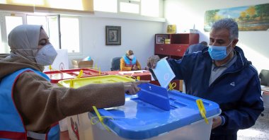 Libyans cast their ballots during the second round of municipal elections, at a voting center in the Andalus neighborhood of the capital Tripoli, Libya, Jan. 7, 2021. (AFP Photo)