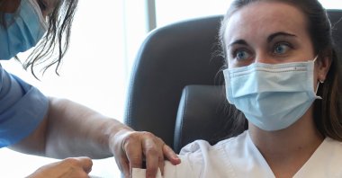A medical staff member receives a dose of the Pfizer-BioNTech coronavirus disease (COVID-19) vaccine at the CHIREC Delta Hospital in Brussels, Belgium Jan. 21, 2021. (Reuters Photo)