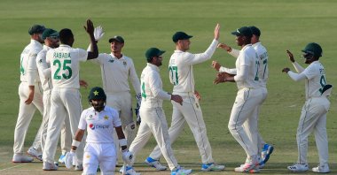 South African players celebrate the dismissal of Pakistan's Imran Butt (front) during the first day of the first Test at the National Stadium, Karachi, Pakistan, Jan. 26, 2021. (AFP Photo)