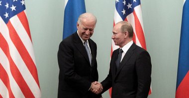 Russia's then-Prime Minister Vladimir Putin (R) shakes hands with U.S.' then-Vice President Joe Biden during their meeting in Moscow March 10, 2011. (Reuters File Photo)
