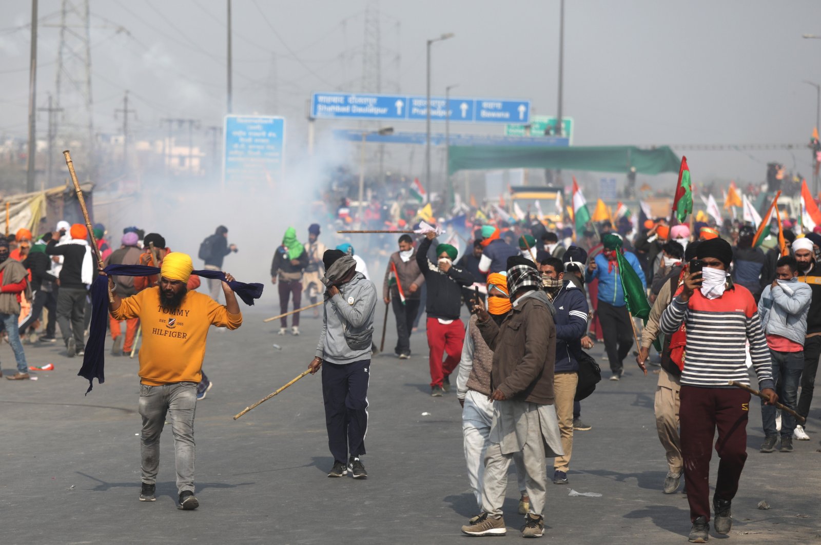 Police use tear gas against protestors during the ongoing farmers' protest of the new agricultural laws, on the outskirts of New Delhi, India, Jan. 26, 2021. (EPA Photo)