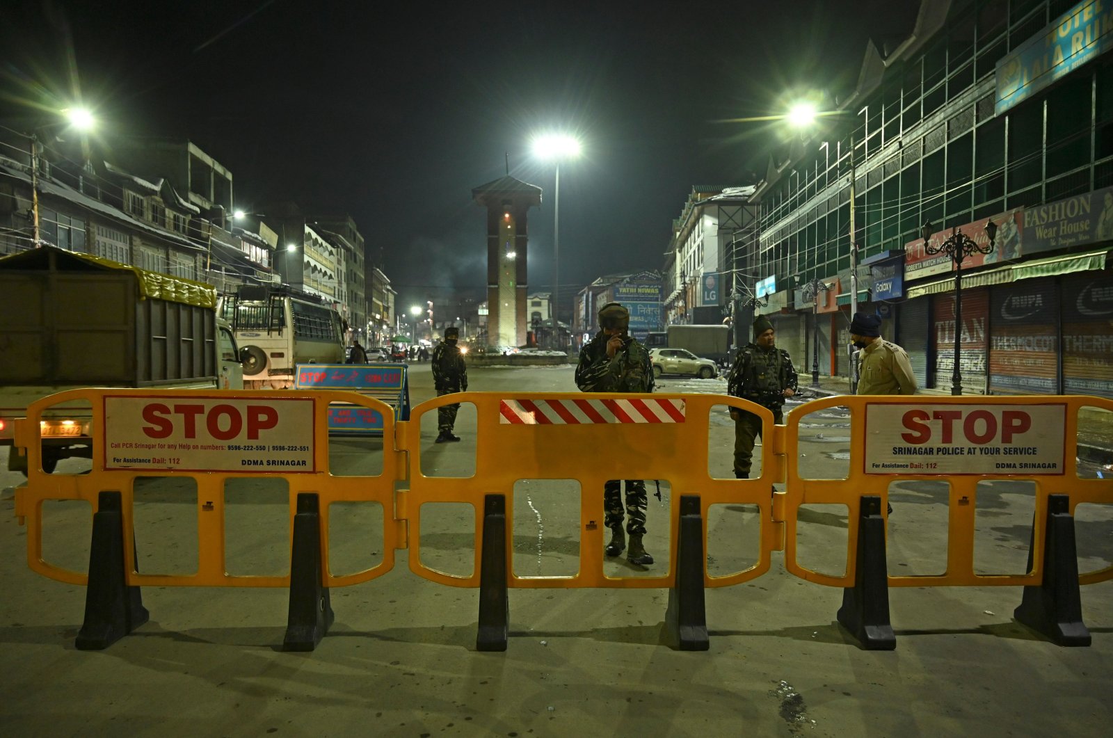 Paramilitary troopers stand guard along a street on the eve of India's Republic Day celebrations in Srinagar, India-occupied Jammu and Kashmir, Jan. 25, 2021. (AFP Photo)