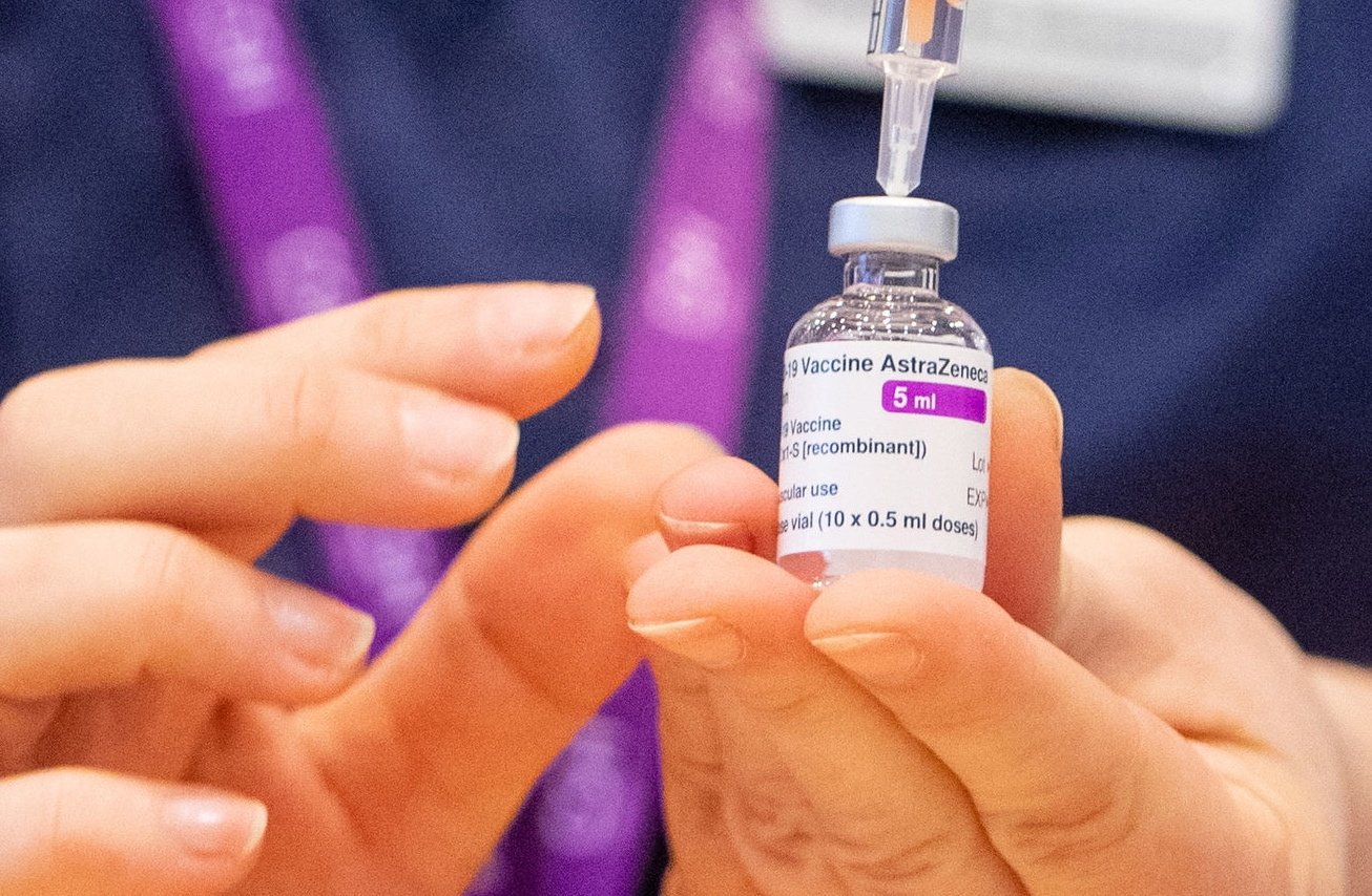 A nurse prepares a dose of the Oxford-AstraZeneca COVID-19 vaccine at a mass vaccination center, in Surrey, Britain, Jan. 11, 2021.
