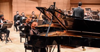 The Pekinel sisters perform at the opening concert of the Presidential Symphony Orchestra's new hall, in the capital Ankara, Turkey, Dec. 3, 2020.