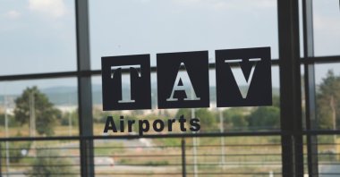 TAV Airports' logo is seen on an airport window in Skopje, Macedonia, Aug. 10, 2019. (Shutterstock Photo)