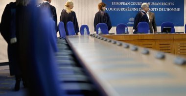 Judges of the European Court of Human Rights enter the hearing room of the court in Strasbourg, France, Dec. 3, 2013. 