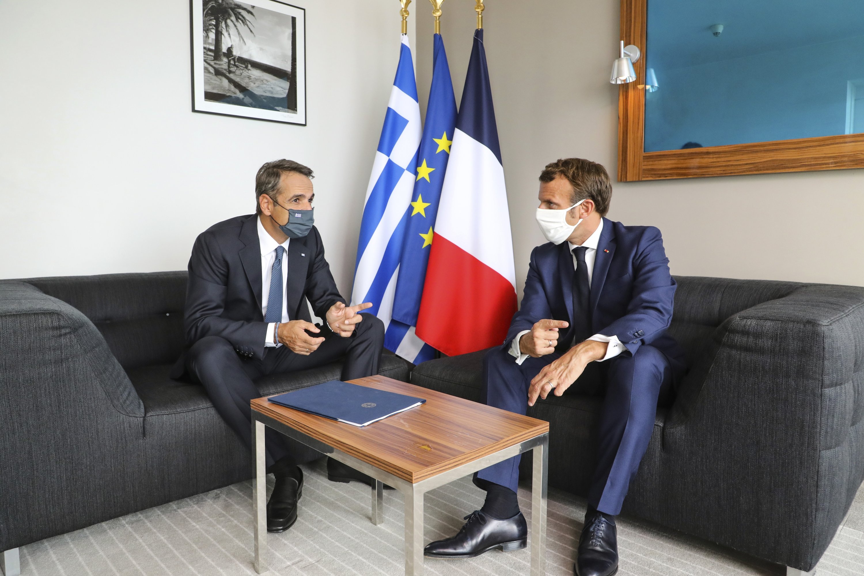 Greek Prime Minister Kyriakos Mitsotakis (L) meets with French President Emmanuel Macron in Porticcio on the French island of Corsica, Sept. 10, 2020. (AP Photo)