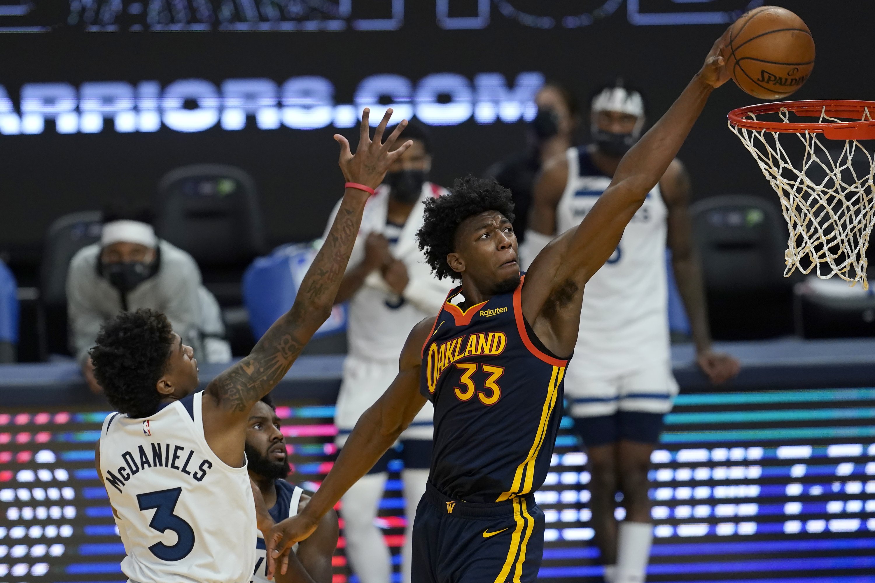 Golden State Warriors center James Wiseman (R) dunks against Minnesota Timberwolves during the second half of an NBA game in San Francisco, U.S., Jan. 27, 2021. (AP Photo)
