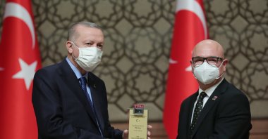 President Recep Tayyip Erdoğan (L) gives an award to professor Alp Can at the science awards ceremony, in the capital Ankara, Turkey, Jan. 28, 2021. (AA Photo)