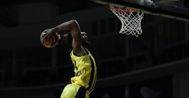 Fenerbahçe Beko's Dyshawn Pierre jumps for a slam dunk at Moscow's Mytishchi Arena, Russia on Jan. 28, 2021 (AA Photo)