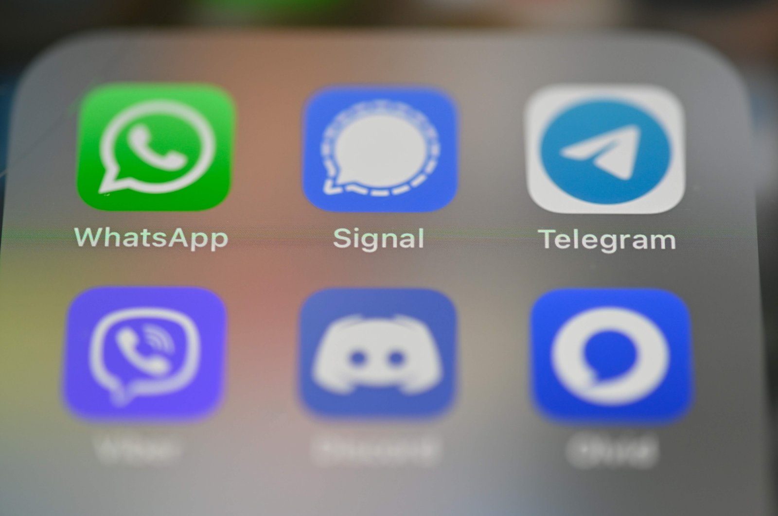 A smartphone screen displays the icons for messaging service applications WhatsApp, Signal, Telegram, Viber, Discord and Olvid in Rennes, western France, Jan. 22, 2021. (AFP Photo)