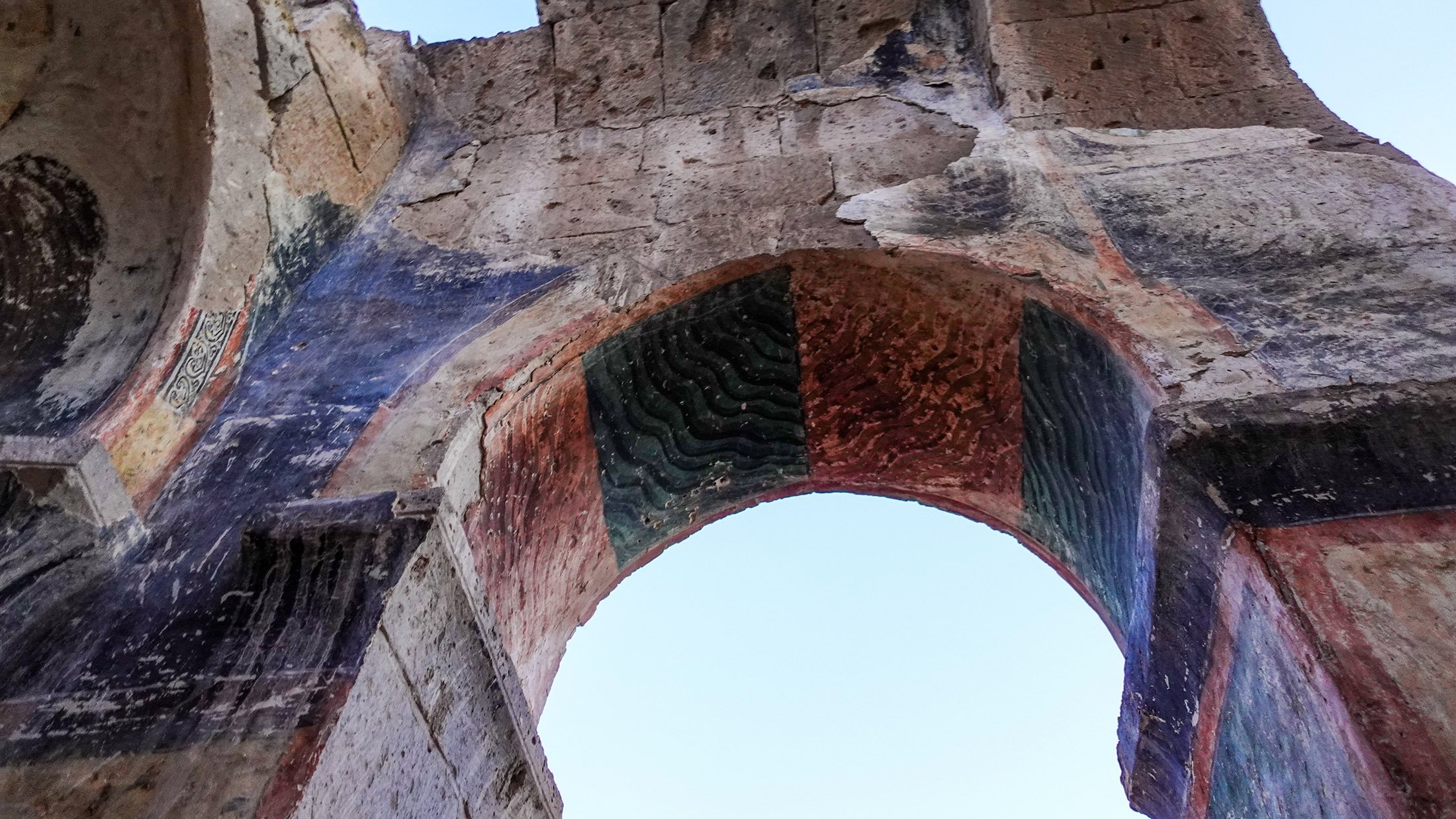 The eroded frescoes at the Bell Church. (Photo by Argun Konuk)